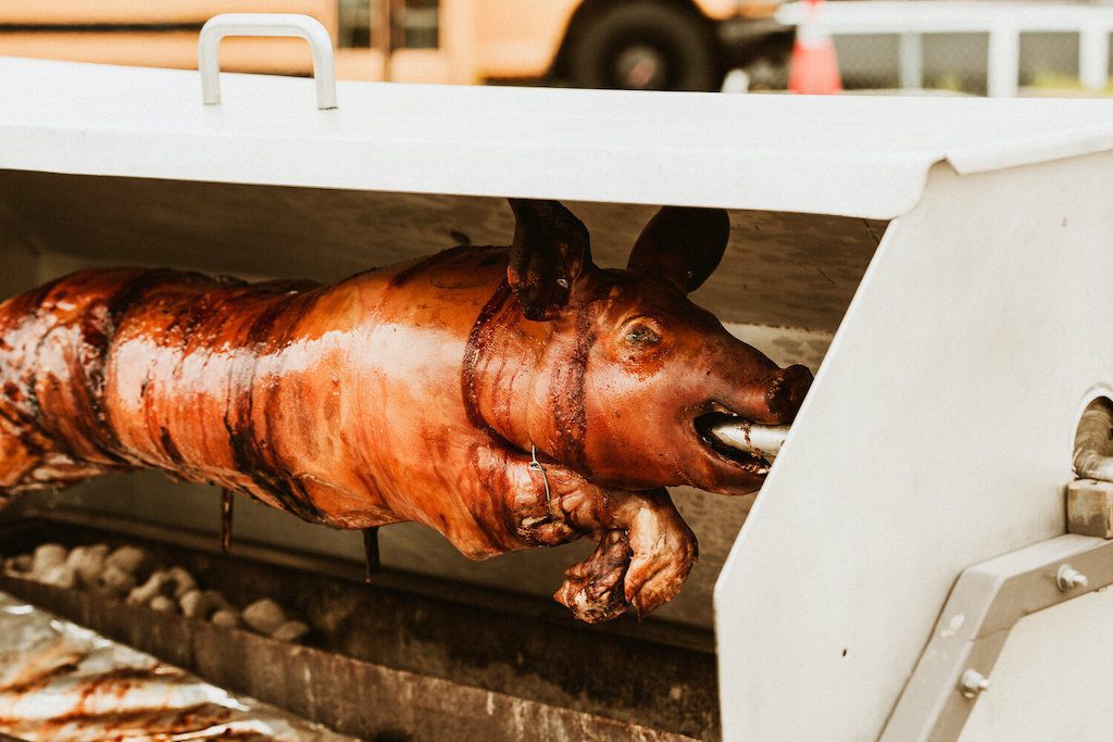 Pig on spit in rotisserie bbq